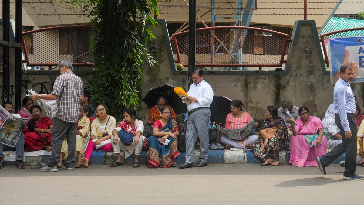 Parents and relatives of National Eligibility Entrance Test (NEET PG) aspirants wait outside an examination centre, at Salt Lake, in Kolkata, Sunday, Aug. 3, 2025.