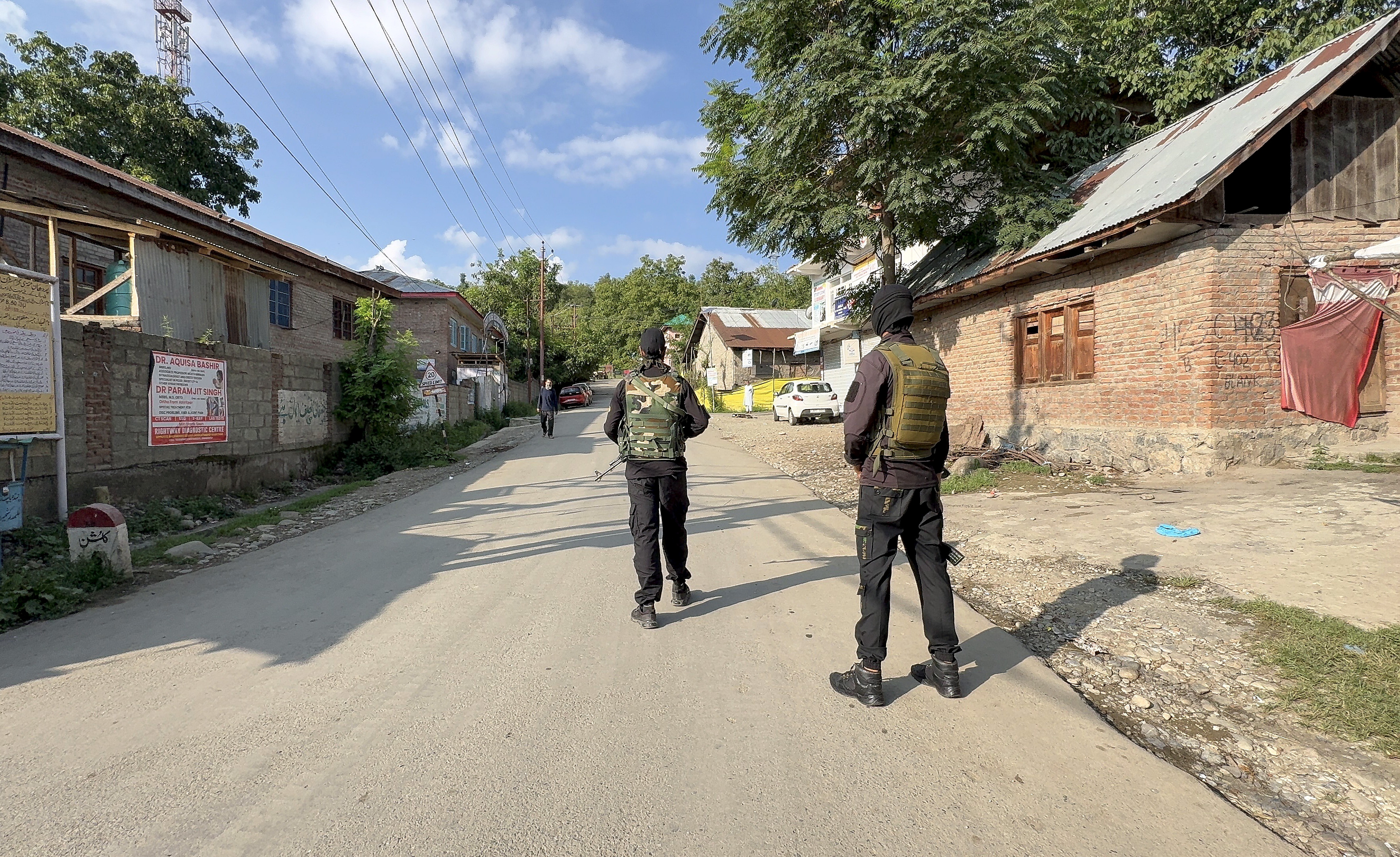 Security personnel keep a vigil amid an ongoing encounter between security forces and terrorists in a forest area at Akhal, in Kulgam district, Jammu and Kashmir, Sunday, Aug. 3, 2025.