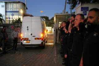 A vehicle carrying the remains of a person whom Hamas claims is a deceased hostage, transferred earlier today by Gaza militants to Israeli authorities, arrives at the Abu Kabir Forensic Institute in Tel Aviv, Israel, Tuesday, Dec. 2, 2025.