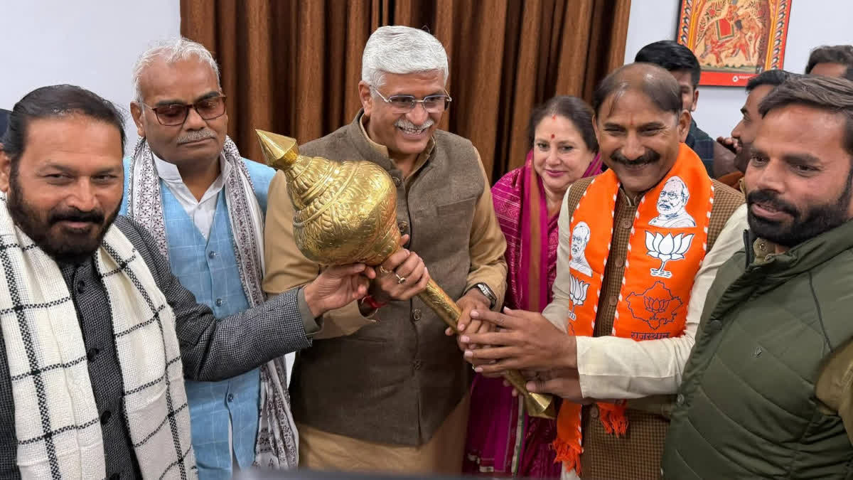 BJP leaders presenting a mace to Shekhawat