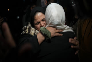 Amani Omran is welcomed by relatives as she arrives at Nasser Hospital in Khan Younis, southern Gaza Strip, early Wednesday, Feb. 4, 2026, after a group of 40 Palestinians was allowed to enter Gaza from Egypt following the long-awaited reopening of the Rafah border crossing.