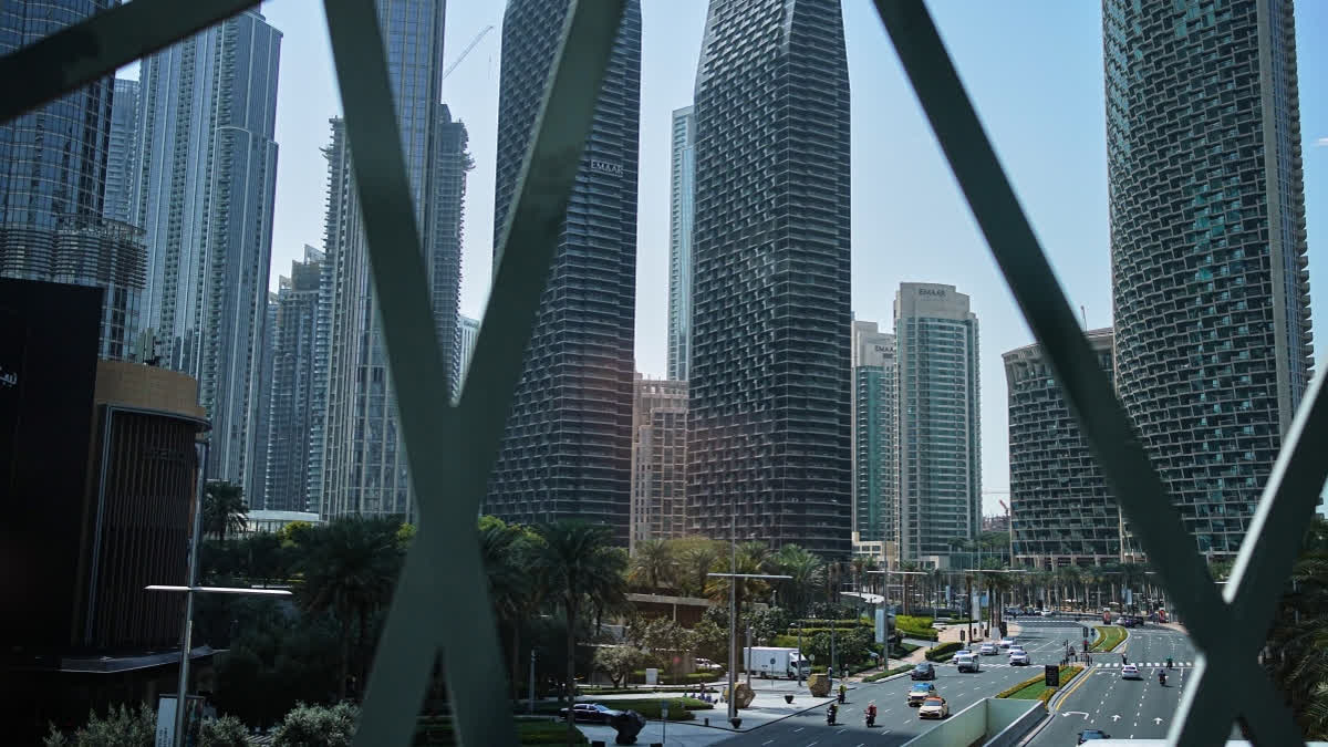 Light traffic moves along a main road in downtown Dubai, United Arab Emirates, Tuesday, March 3, 2026.