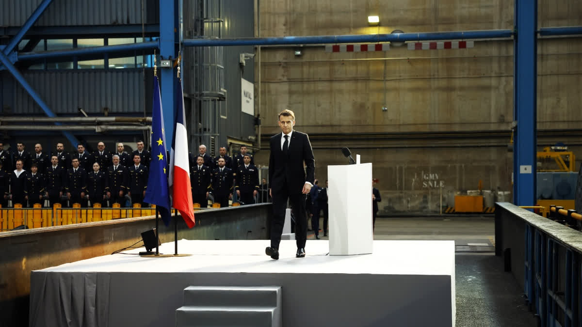 French President Emmanuel Macron leaves the podium afer his speech at the Nuclear submarines Navy base of Ile Longue in Crozon, France, Monday March 2, 2026.