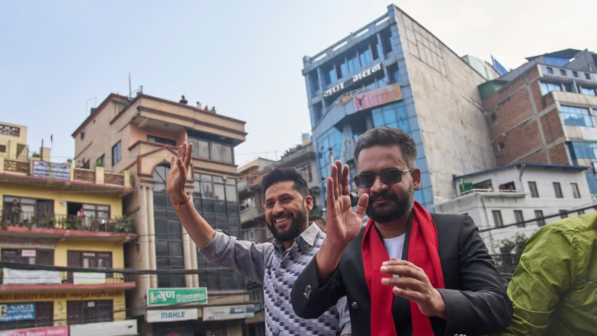 Balendra Shah, right, former mayor of Kathmandu Metropolitan City and prime ministerial candidate of the Rastriya Swatantra Party, joins Rabi Lamichhane, left, the party's president, during an election campaign rally in Lalitpur, Nepal, Saturday, Feb. 28, 2026.