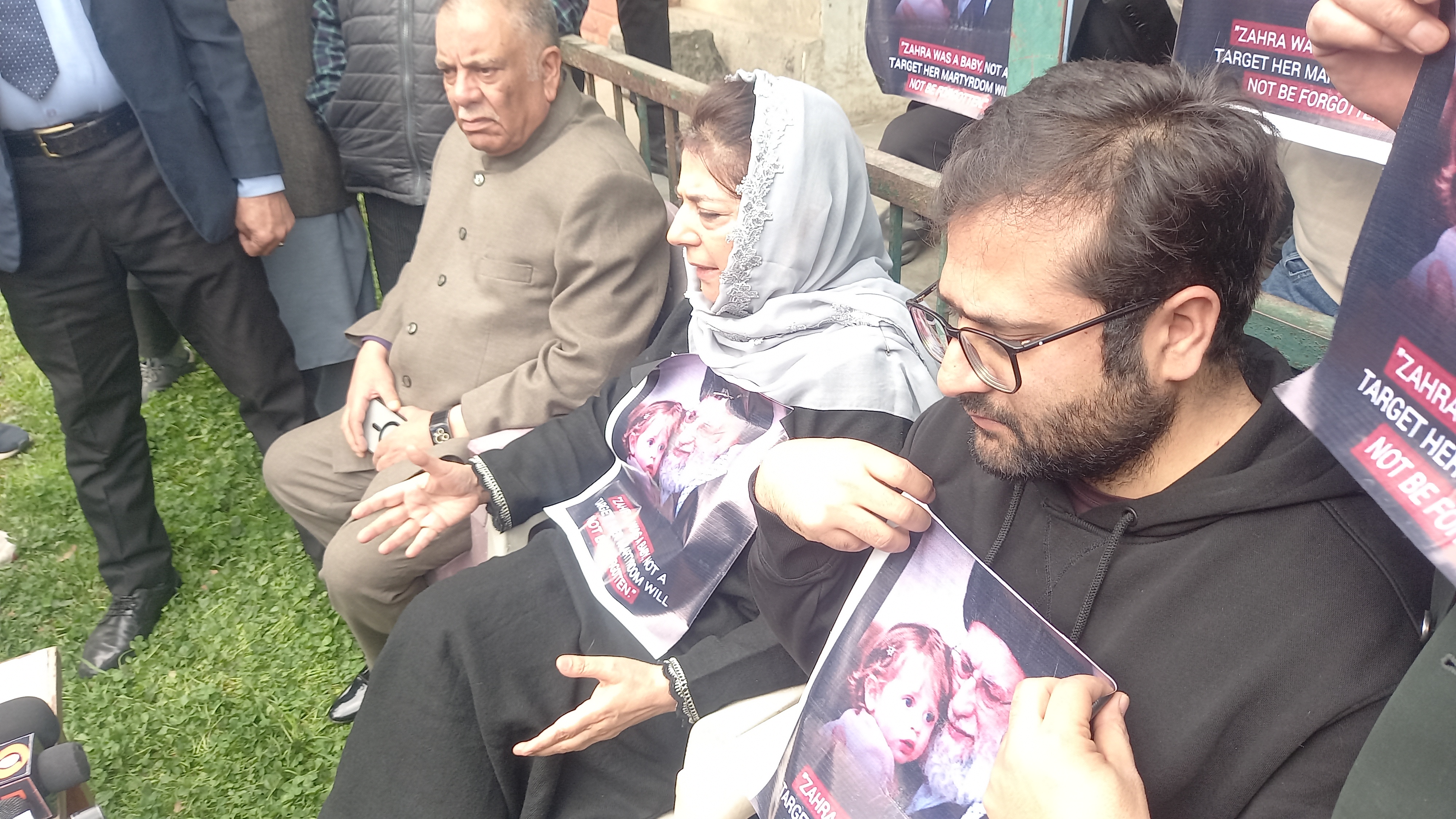 PDP President Mehbooba Mufti(C), party leaders hold presser with posters of slain Iranian Supreme Leader Ayatollah Khamenei in Srinagar