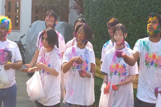 Japanese tourists  celebrate Holi in Puri
