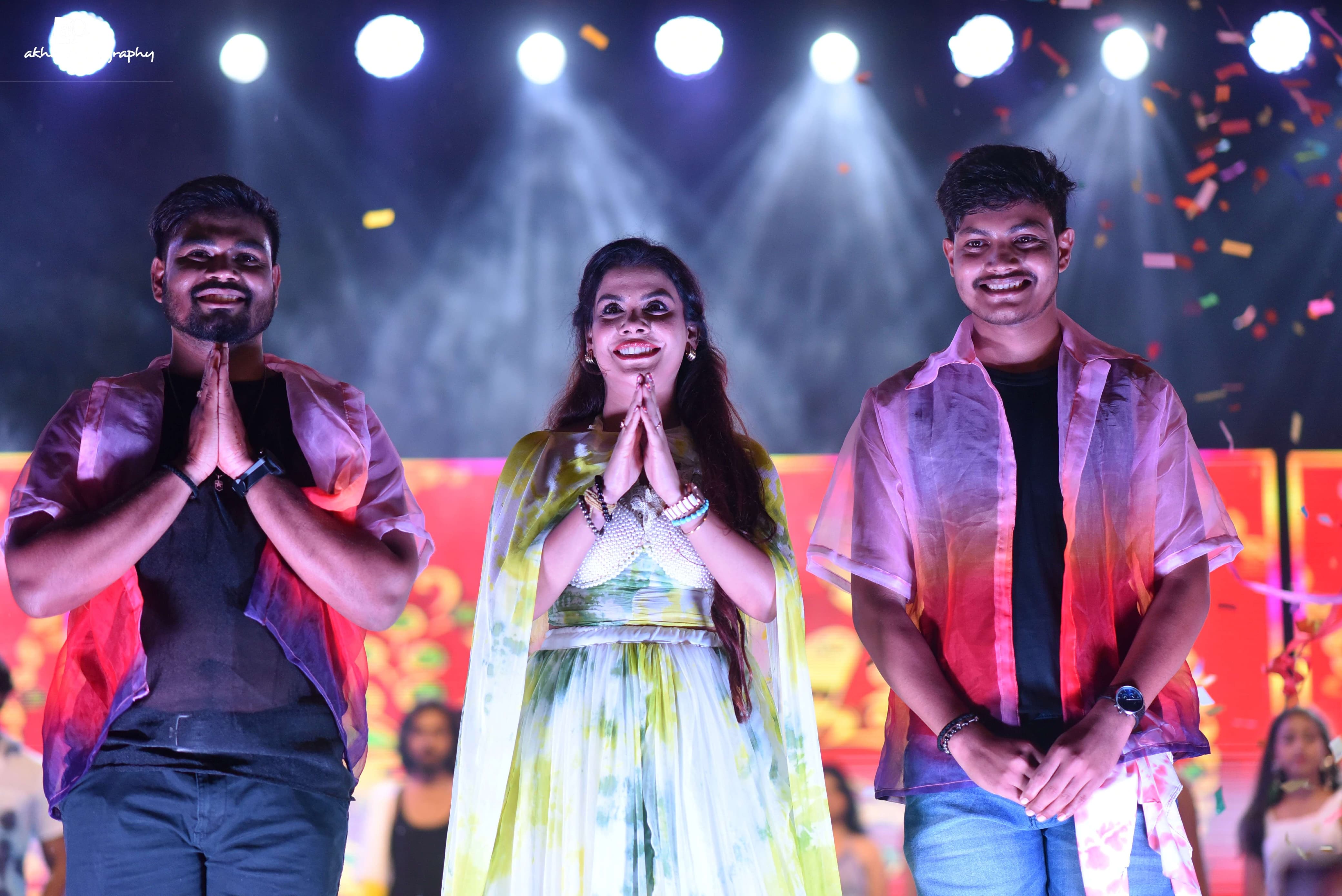Models walk the ramp wearing dresses designed by two brothers
