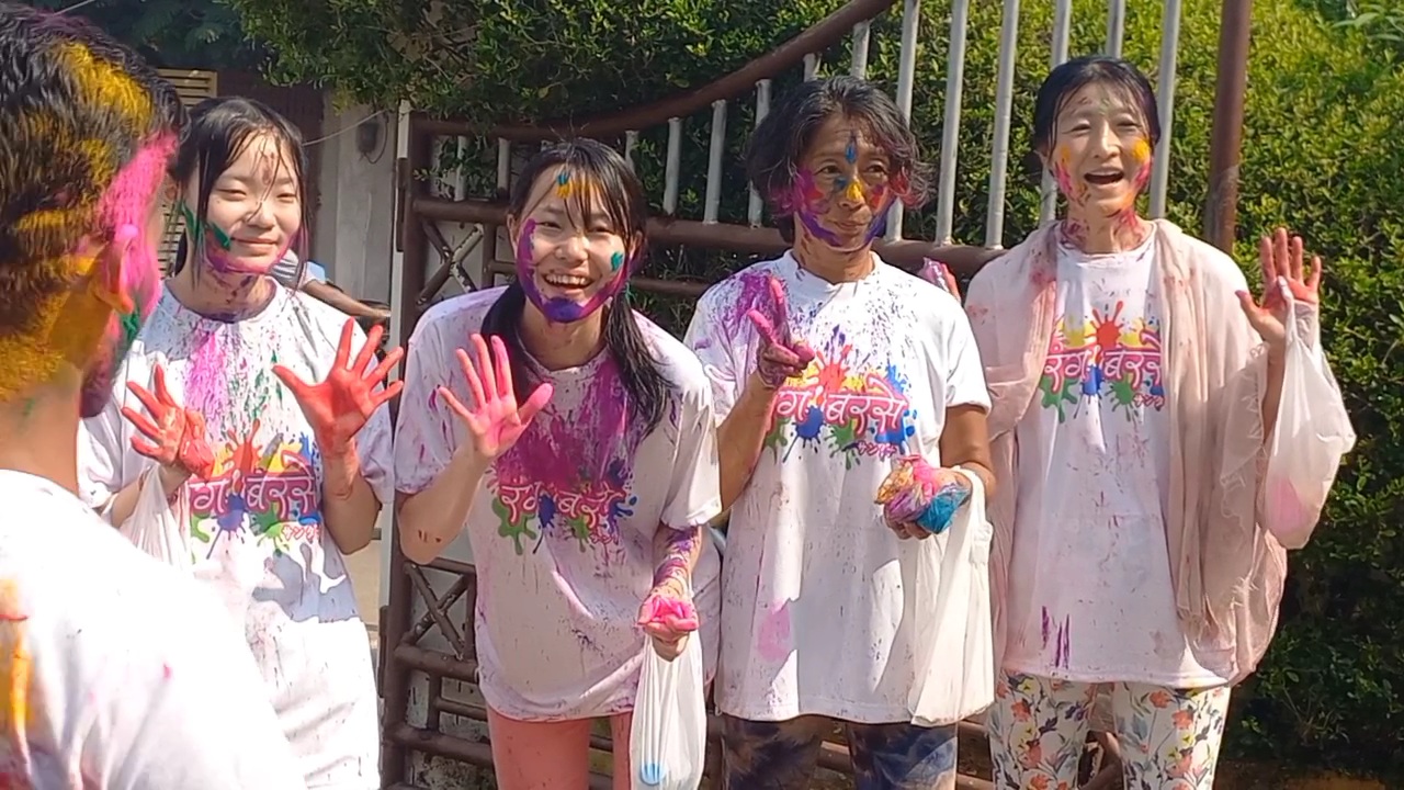 Japanese tourists  celebrate Holi in Puri