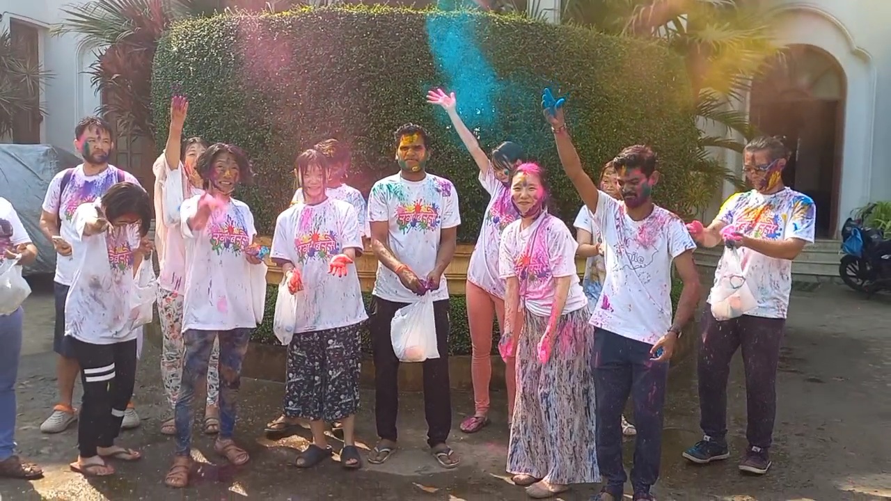Japanese tourists  celebrate Holi in Puri