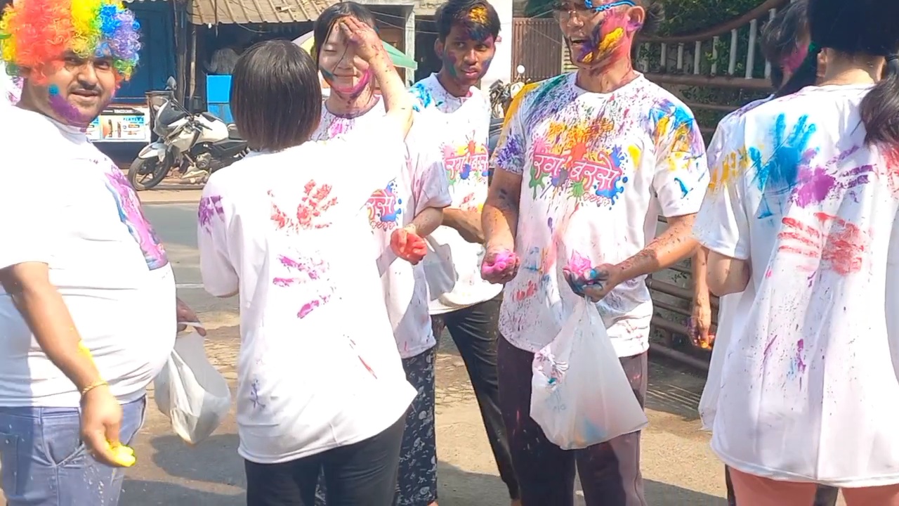 Japanese tourists  celebrate Holi in Puri