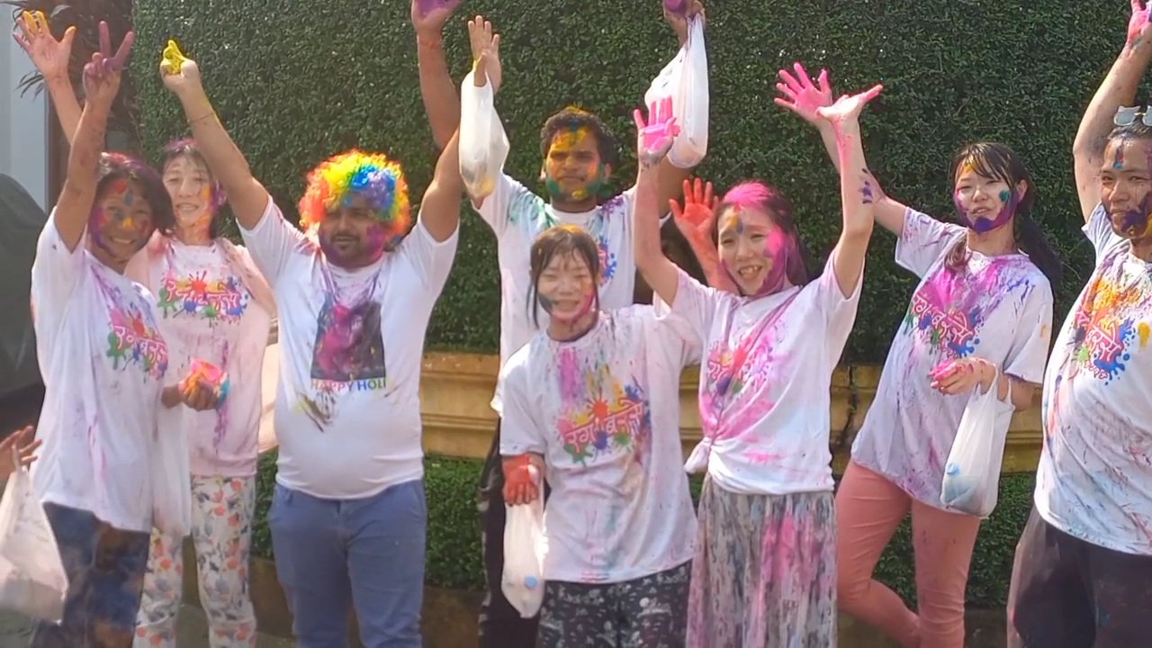 Japanese tourists  celebrate Holi in Puri