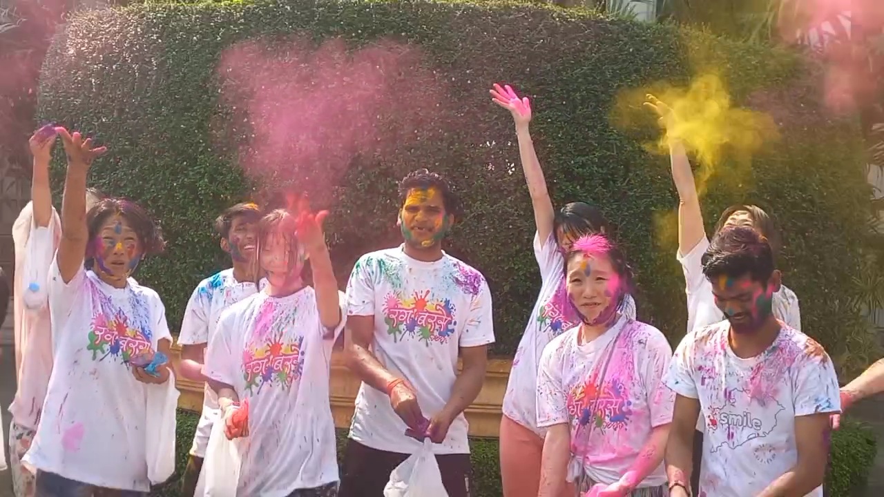 Japanese tourists  celebrate Holi in Puri