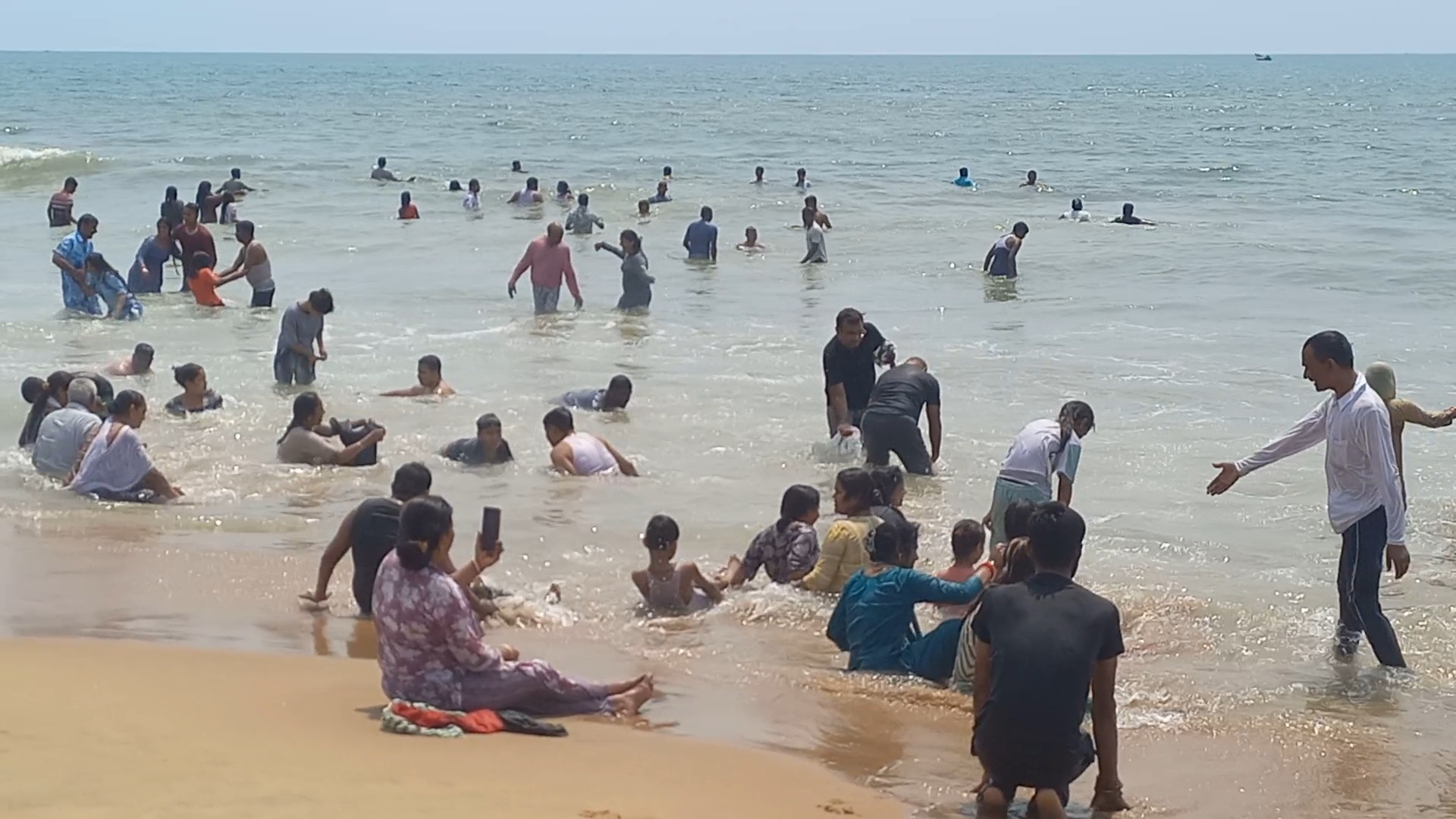 Tourists enjoying the sea.