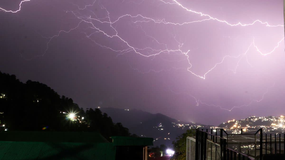 Lightning streaks across the sky over the Himalayan mountains during a spell of inclement weather, in Shimla, Himachal Pradesh, on June 11, 2026.