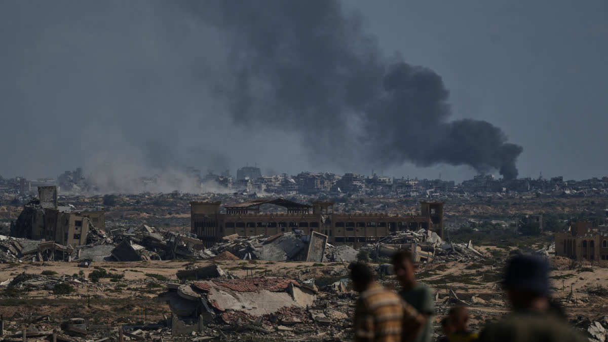 Smoke rises to the sky following an Israeli military strike in Gaza City, as seen from the central Gaza Strip, Thursday, Oct. 2, 2025.