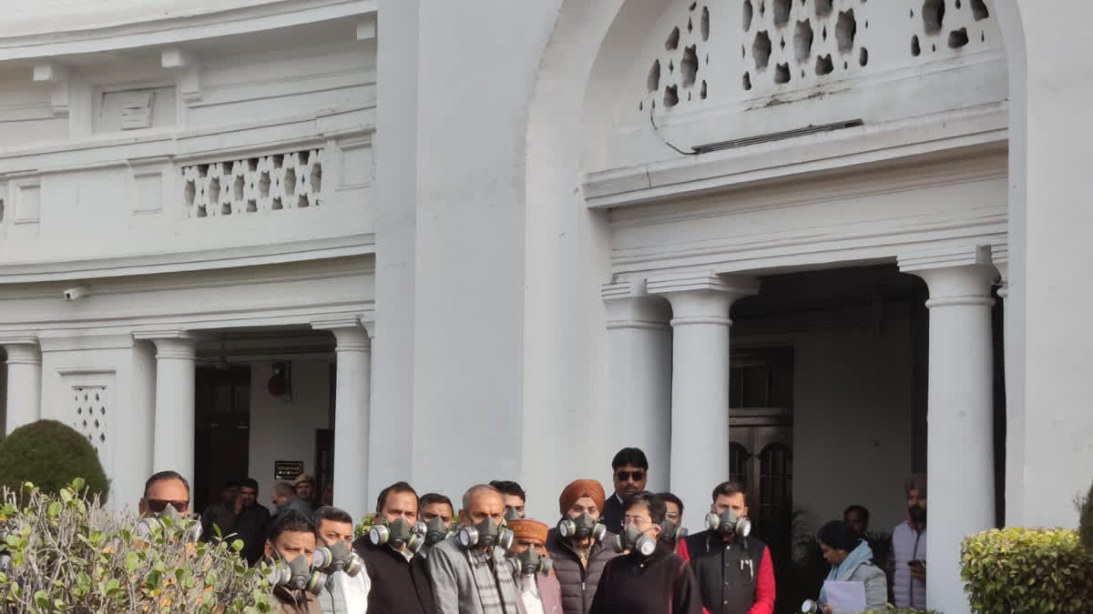 AAP leaders arrive at the Delhi Assembly wearing masks