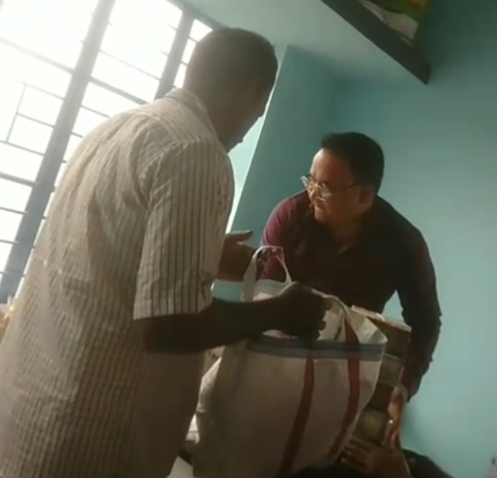 Local businessman Rakibaul Islam is seen in the footage with a nylon bag filled with cash.