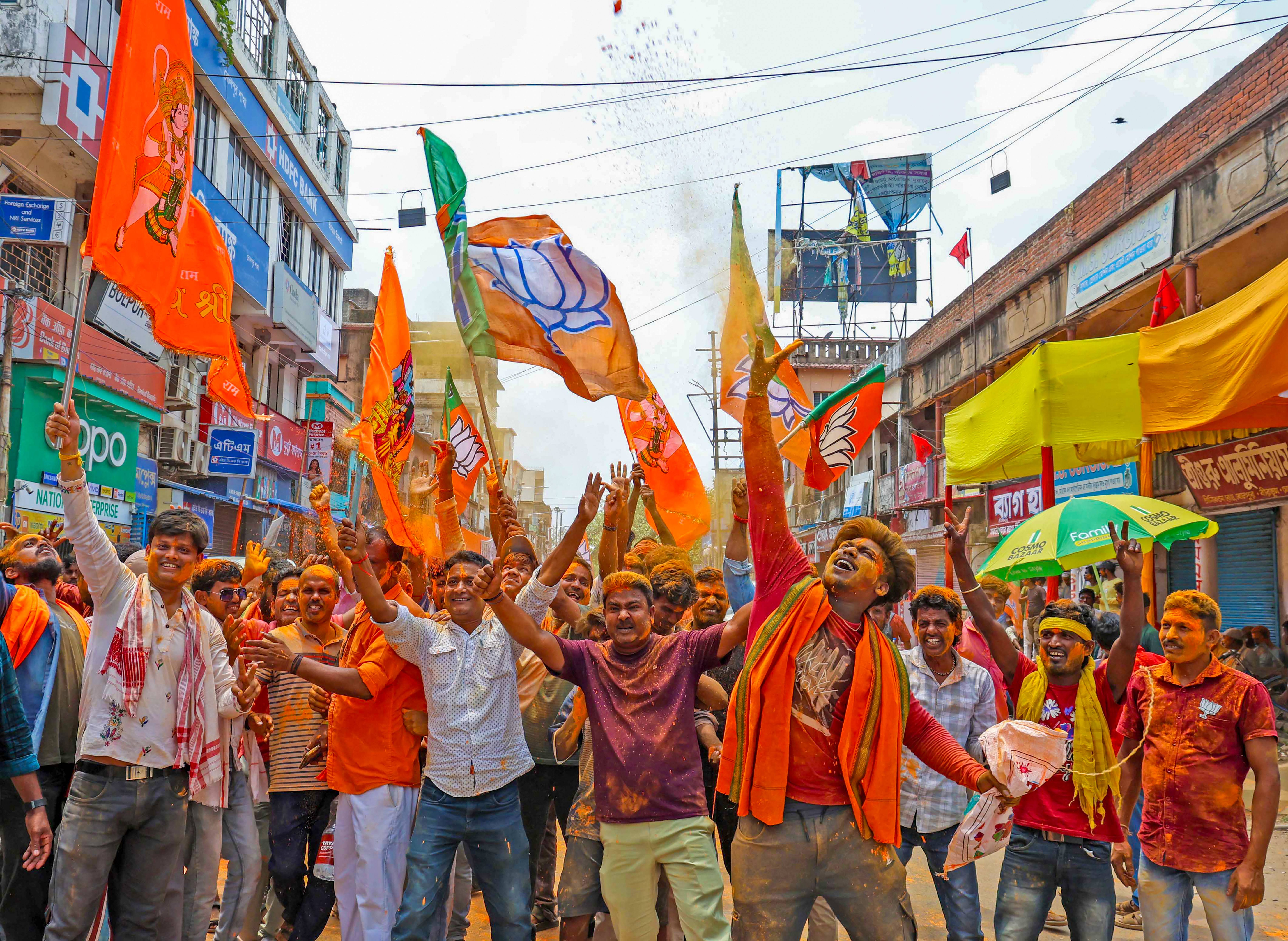 BJP workers celebrate as the party shows a winning trend during the counting of votes in Birbhum.