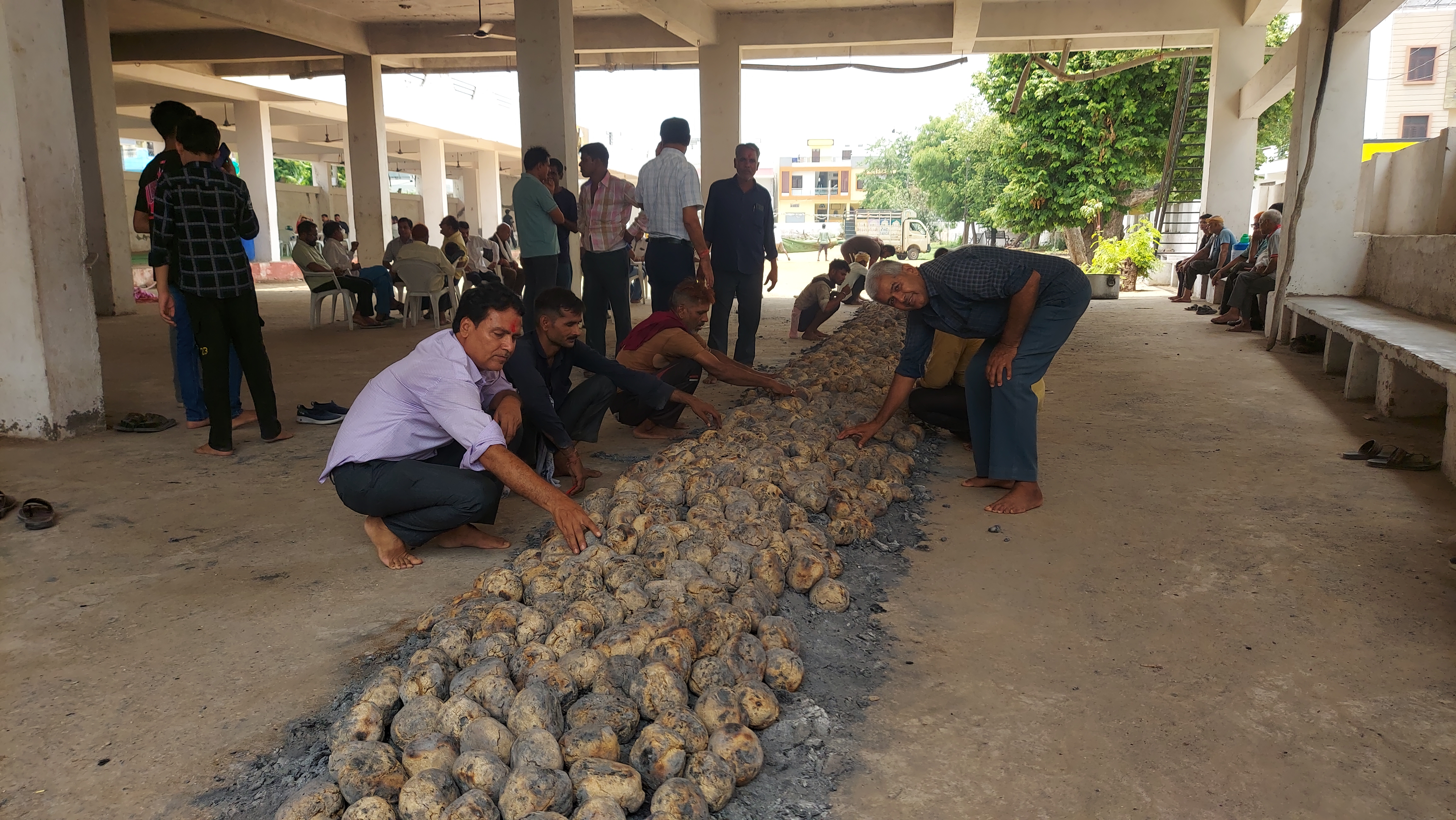 Young people making baatis for churma