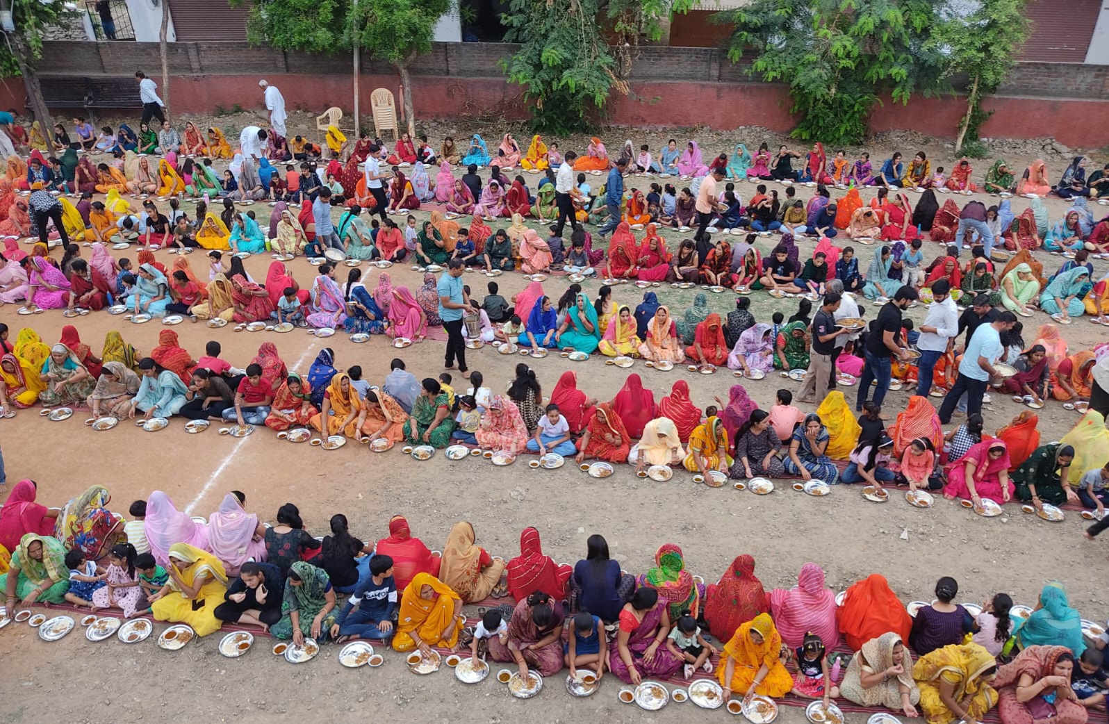Women receive the Prasad first