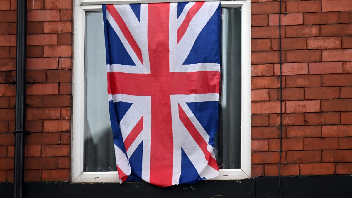 A Union flag hung from the window of a residential property in Denton, Greater Manchester on February 12, 2026.