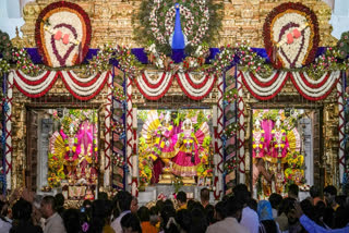 Devotees gather to offer prayers before decorated idols of Lord Krishna and Radha on the occasion of Krishna Janmashtami at the ISKCON Temple in Bengaluru.