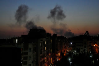 Plumes of smoke rise as strikes hit the city during the U.S.–Israeli military campaign in Tehran, Iran, Friday night, March 6, 2026.