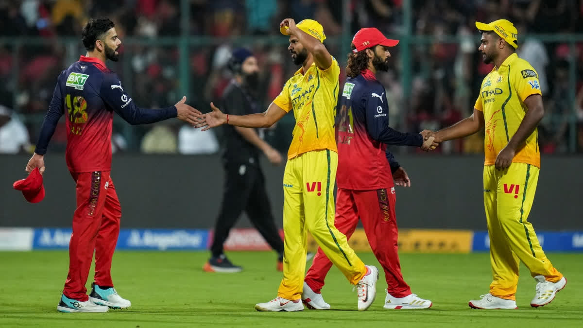 RCB's captain Rajat Patidar, second right, and Virat Kohli, left, being congratulated by CSK' captain Ruturaj Gaikwad, second left, and Sanju Samson after winning the IPL 2026 T20 cricket match in Bengaluru, Sunday, April 5, 2026.
