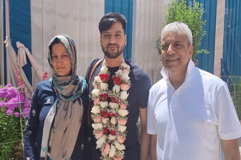 Kashmir youth Faizan Mir becomes civil servant in London