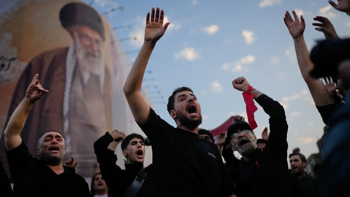 Iran Begins A Procession Through Tehran For Supreme Leader Ayatollah Ali Khamenei's Funeral Mourners chant slogans while gathered in Islamic Revolution Square for the funeral procession of the slain Iranian Supreme Leader Ayatollah Ali Khamenei beneath a billboard depicting Khamenei in Tehran, Iran, Monday, July 6, 2026.