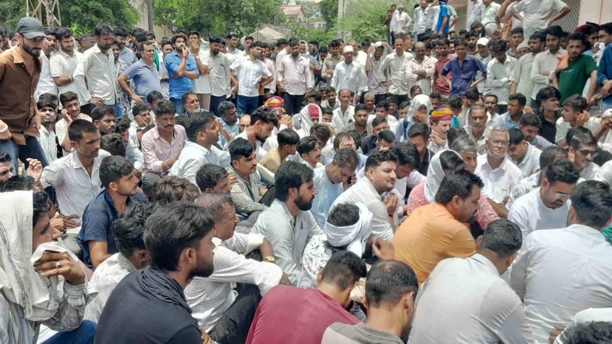 Villagers and family members staging a sit-in protest