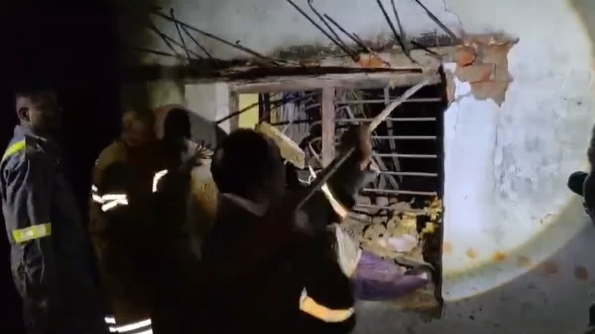 Officials inspect the collapsed house in Mahuli village after six family members died in the tragic incident on Thursday.