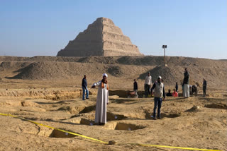 FILE - Egyptian antiquities workers dig at the site of the Step Pyramid of Djoser in Saqqara, 24 kms. (15 miles) southwest of Cairo, Jan. 26, 2023.