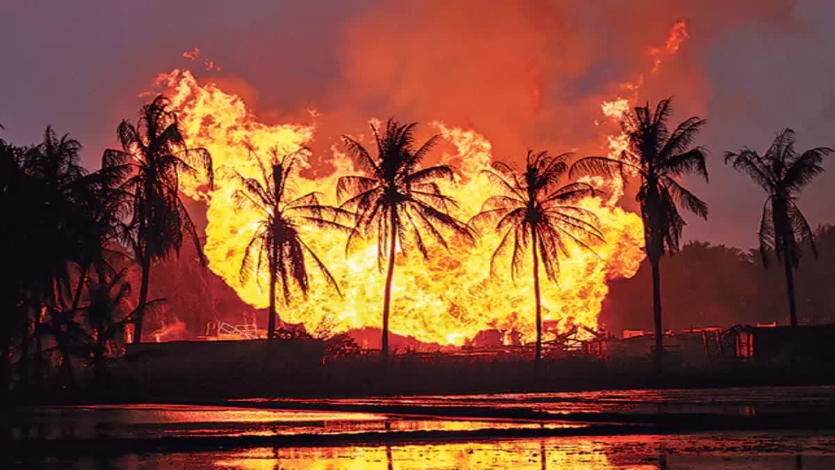 Flames rising from a fire at an ONGC well
