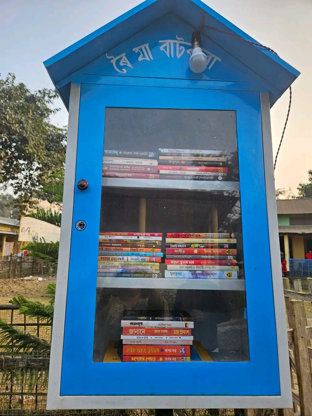 A writer has set up a small library by the roadside at Mukalmua in Nalbari
