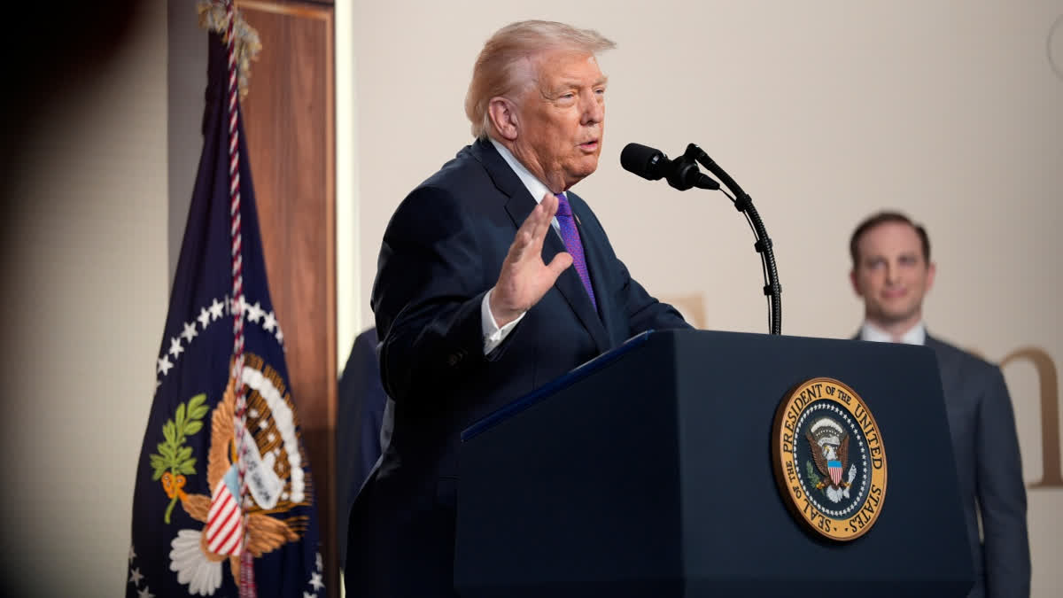 President Donald Trump speaks about TrumpRx in the South Court Auditorium in the Old Eisenhower Executive Office Building on the White House campus, Thursday, Feb. 5, 2026, in Washington, as National Design Studio director Joe Gebbia listens.