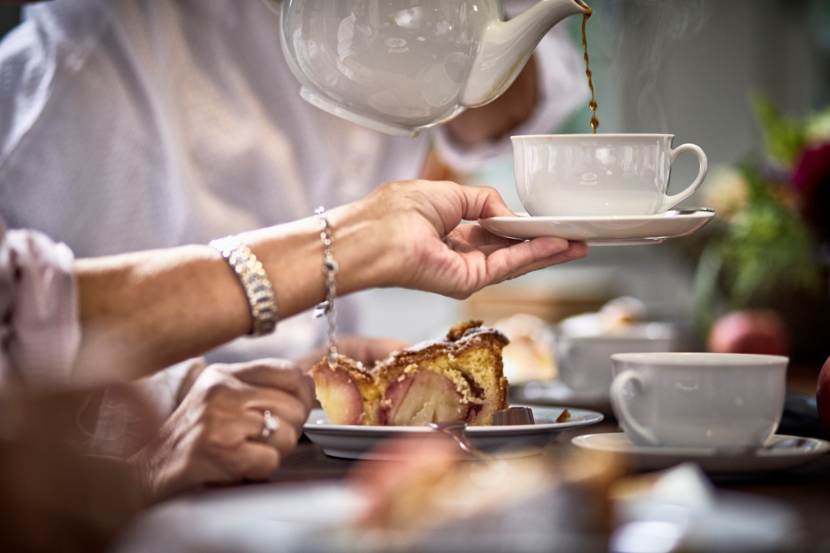 Coffee being served with cake