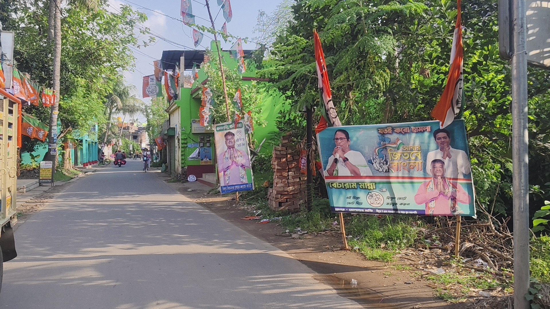 Banners of political parties on a street in Singur.