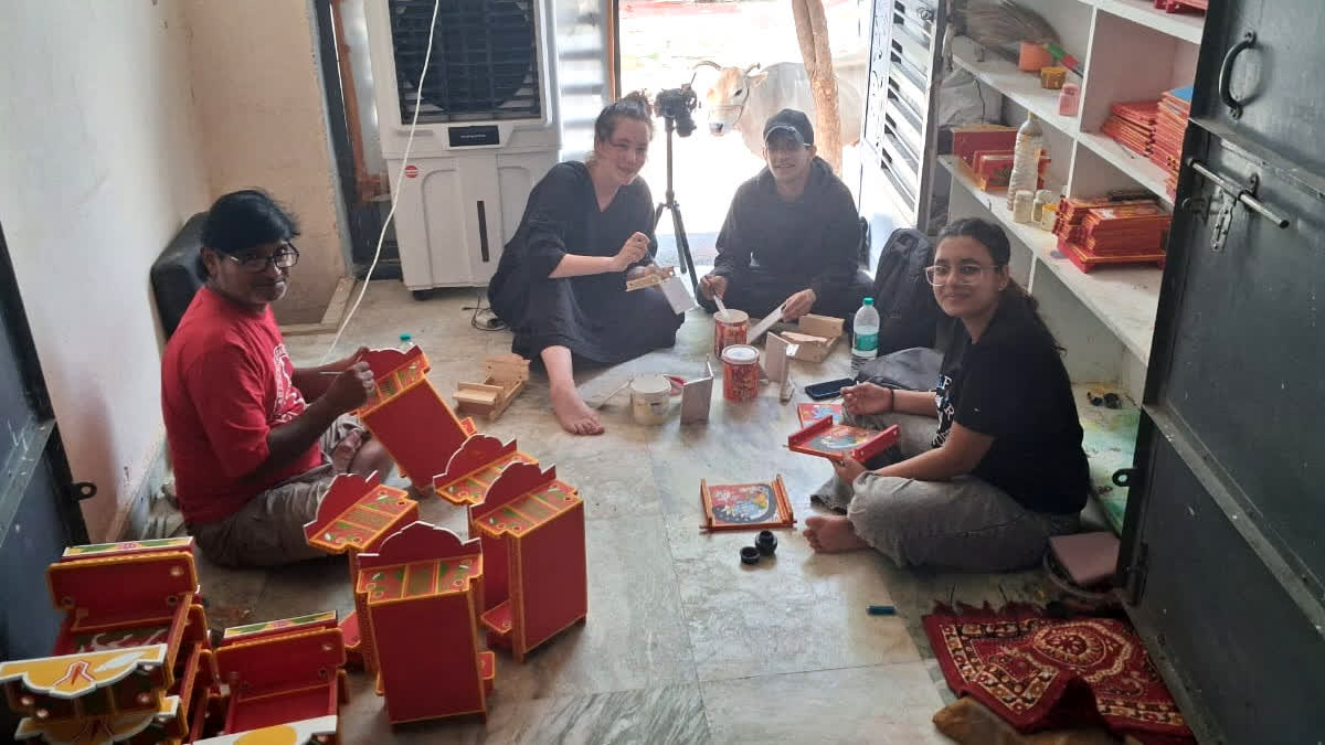 Researchers learning the art of Kavad making