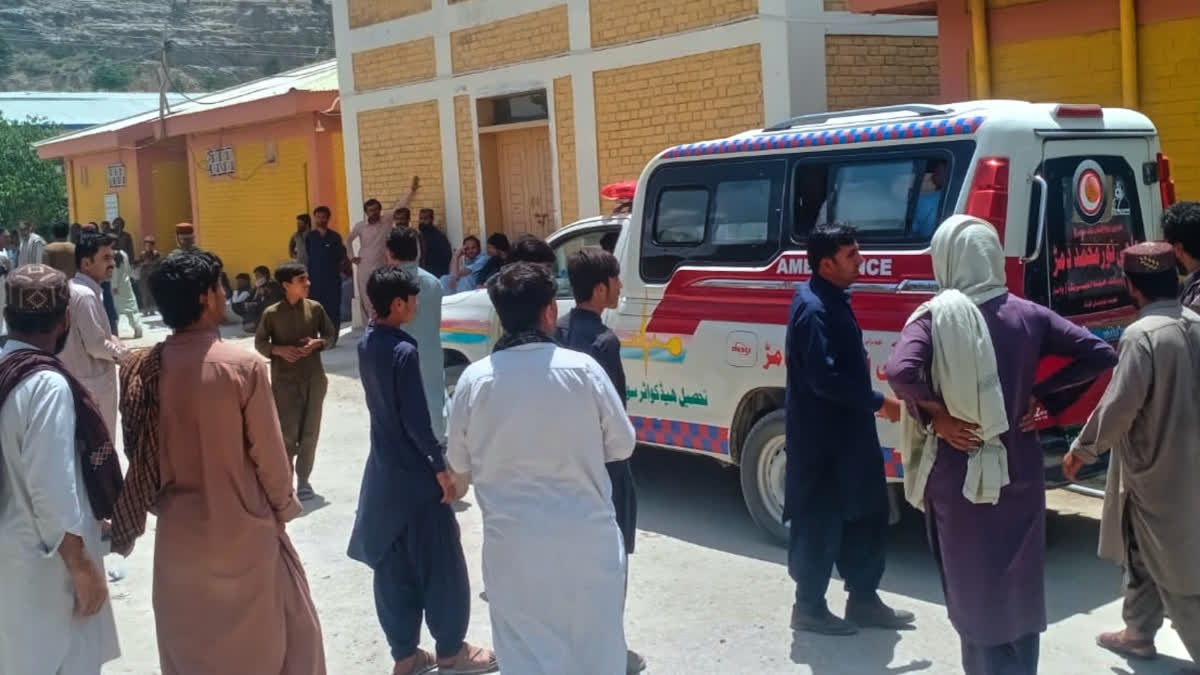 People watches an ambulance arrive with the bodies of police officers who were killed in an militants overnight attack, at a hospital in Ziarat, a district in Pakistan's southwetern Balochistan province, Tuesday, July 7, 2026.