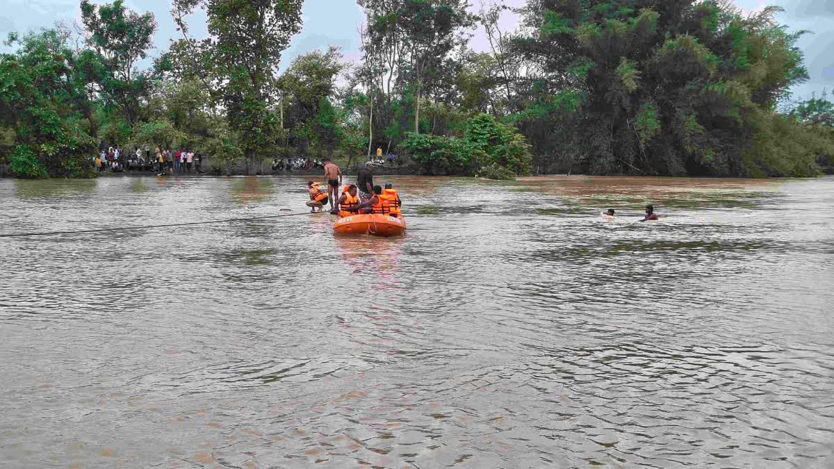 electricity department vehicle swept in water