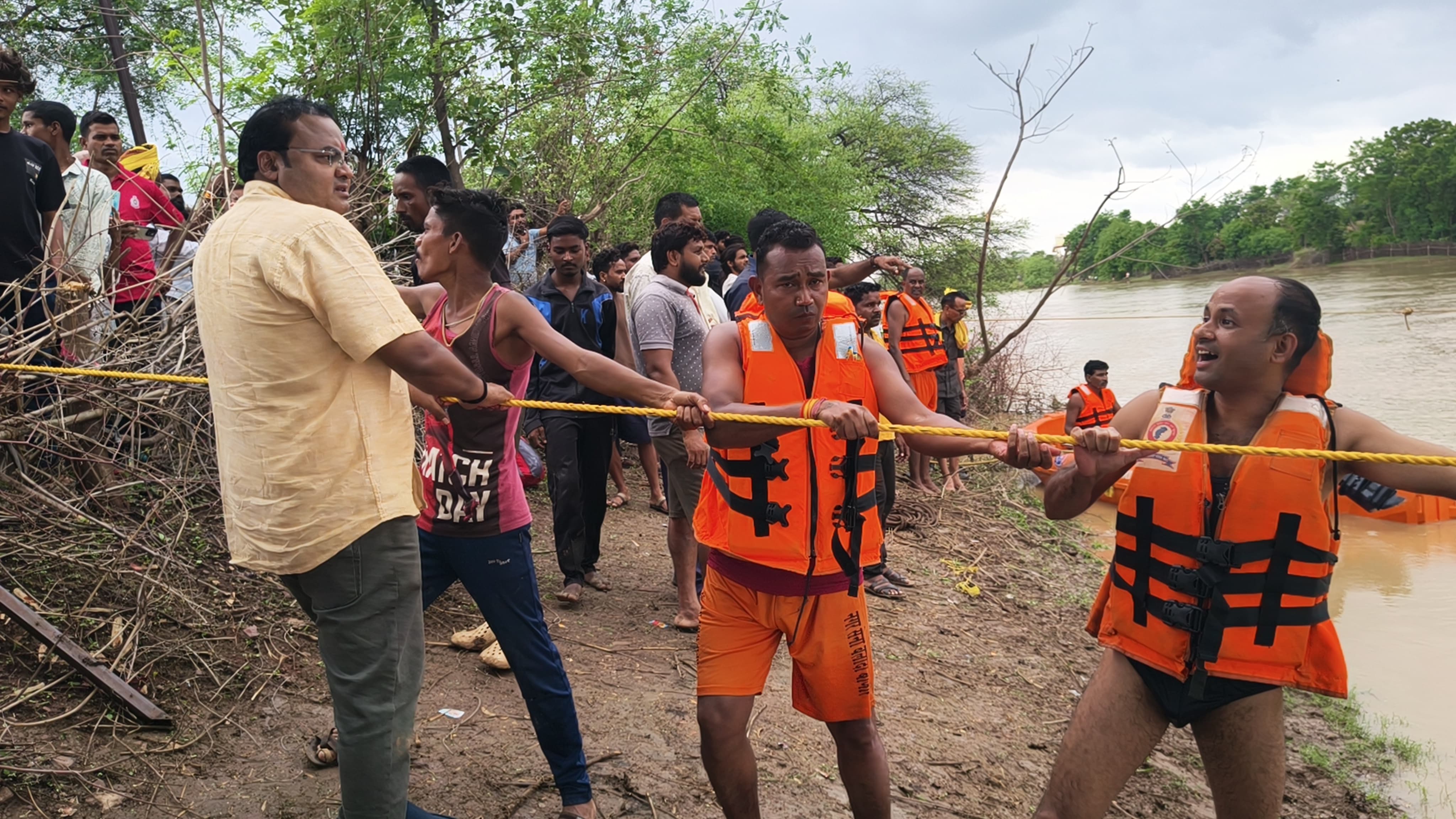 electricity department vehicle swept in water