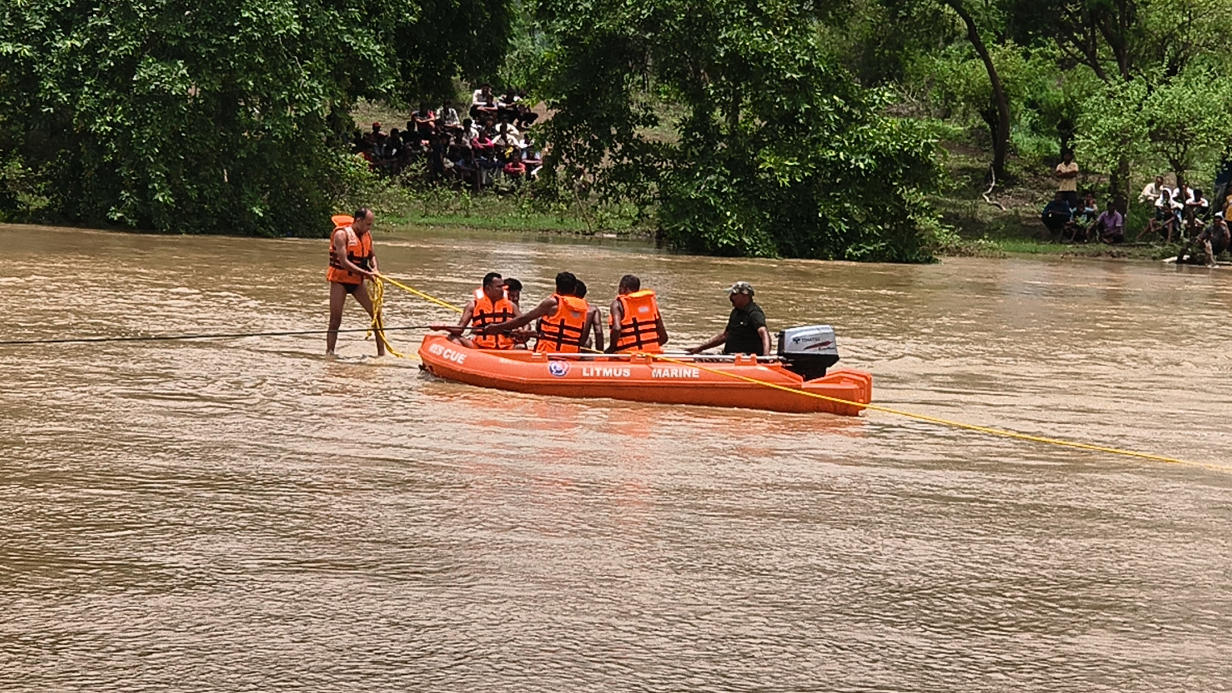 electricity department vehicle swept in water