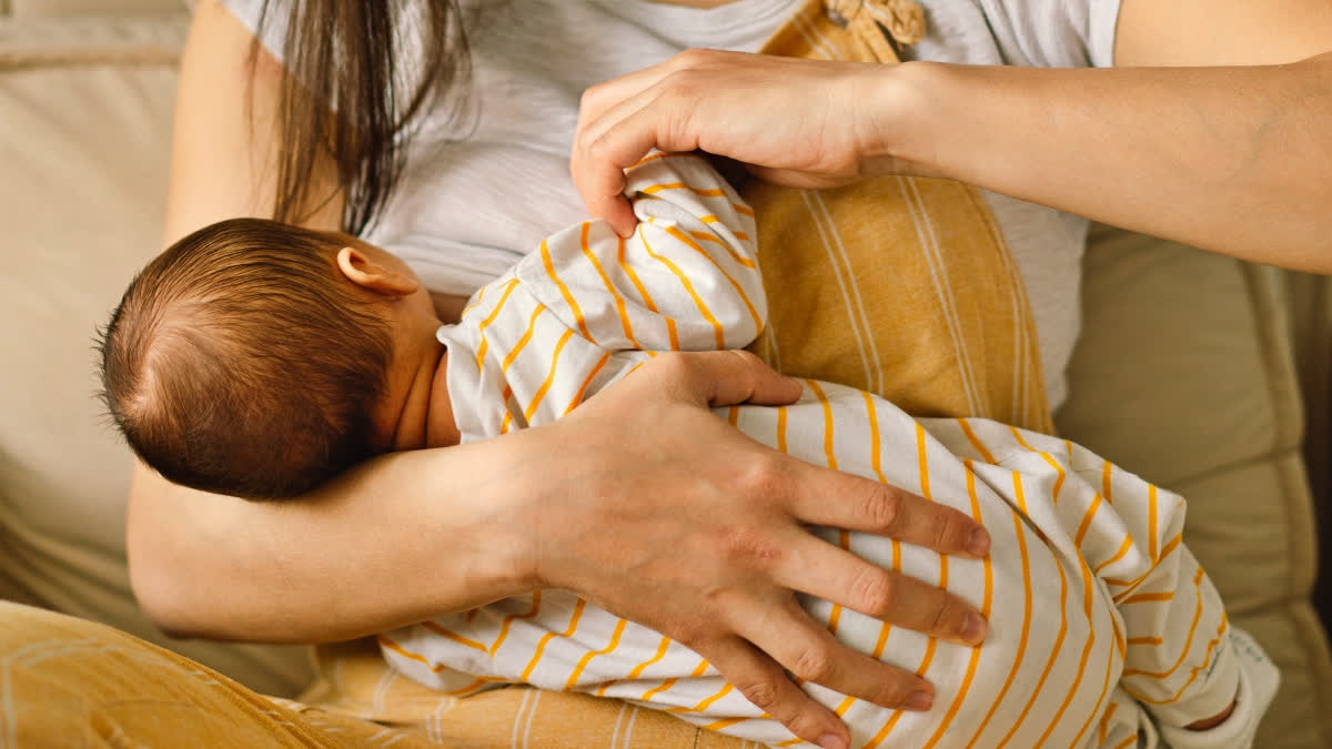 Woman breastfeeding a baby