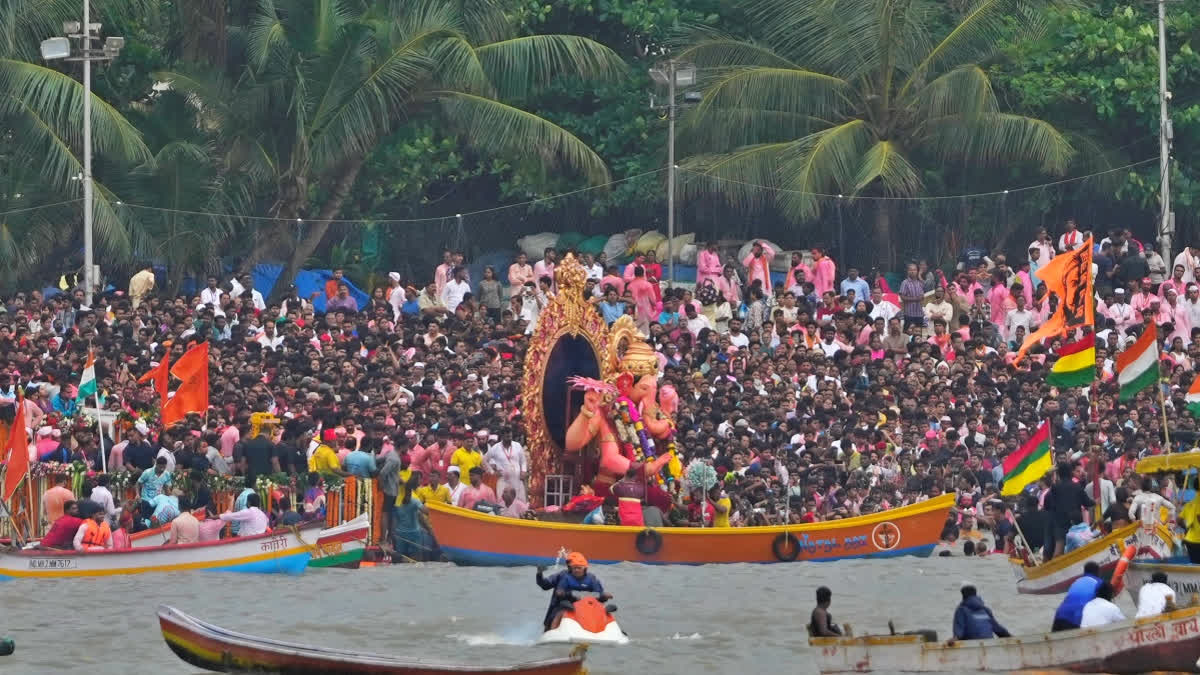 Lalbaugcha Raja's idol awaits immersion after a 23-hour procession, as it was delayed due to high tide and raft glitches.
