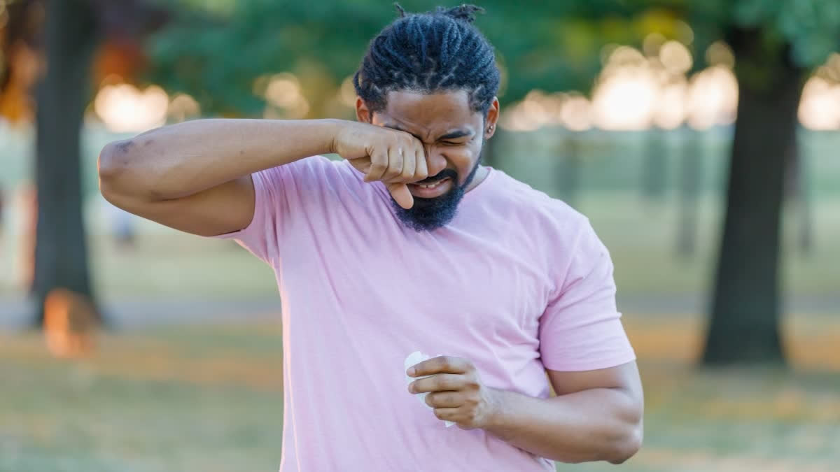 Man rubbing his eyes