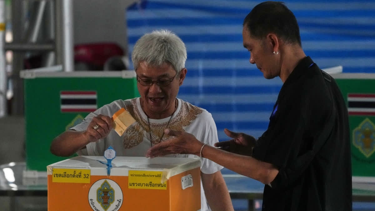 A voter casts his ballot at a polling station during general election in Bangkok, Sunday, Feb. 8, 2026.