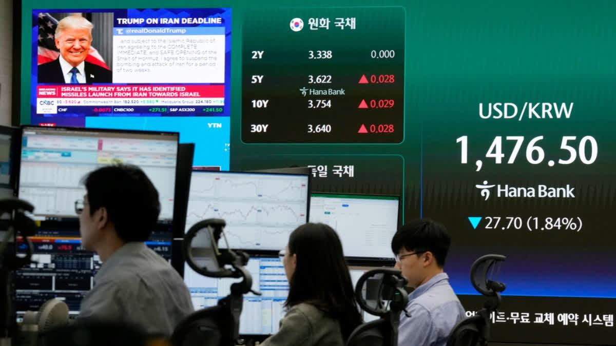 U.S. President Donald Trump is seen on a screen as traders work at the foreign exchange dealing room of the Hana Bank headquarters in Seoul, South Korea, Wednesday, April 8, 2026.