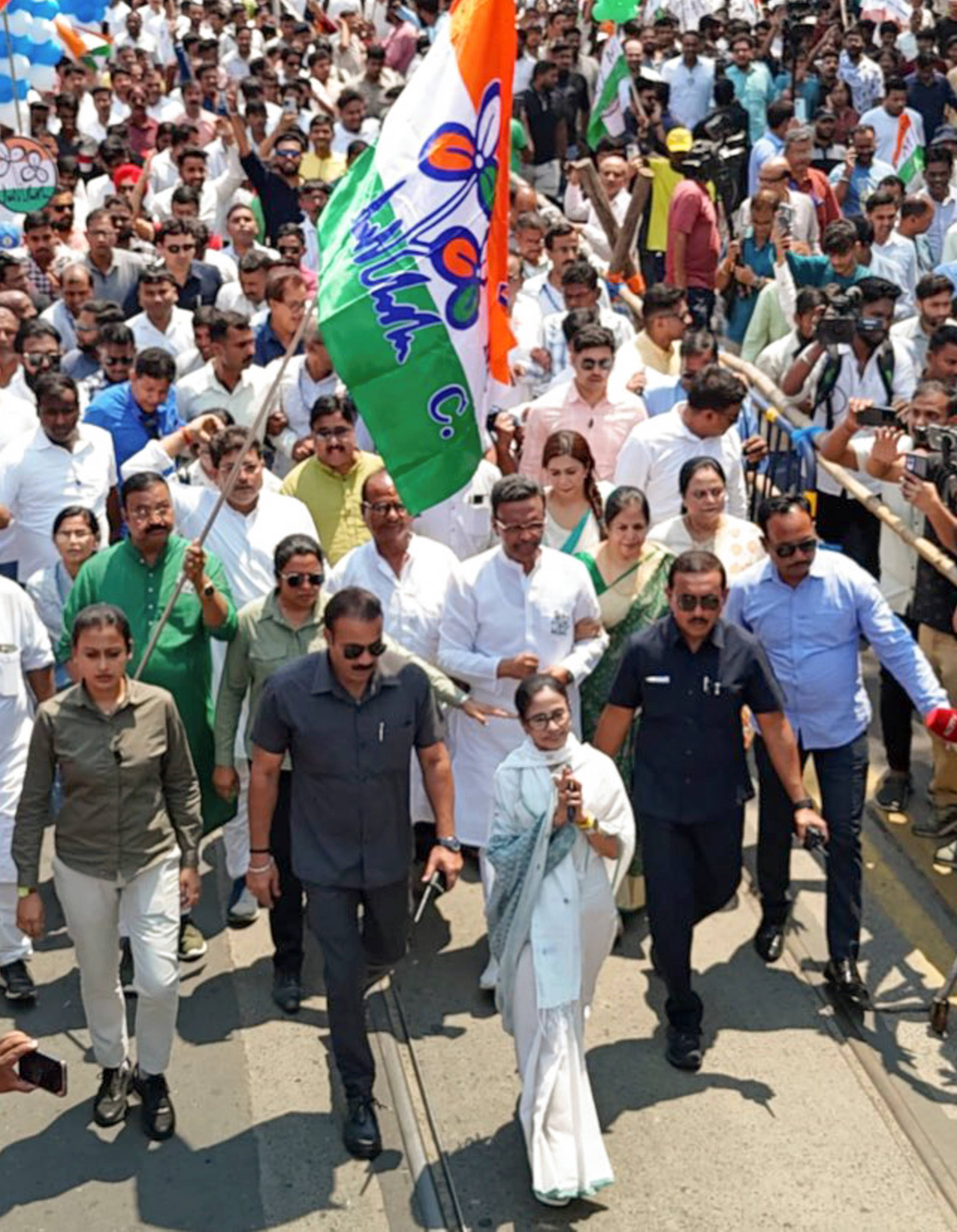 Mamata Banerjee greets the gathering after filing her nomination papers in Bhapanipur on Wednesday.