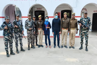SSB and police officials with the two arrested foreign nationals.